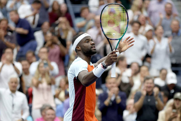 Frances Tiafoe of the United States celebrates winning the second set against Andrey Rublev during their Men’s Singles Quarterfinal match on Day Ten...