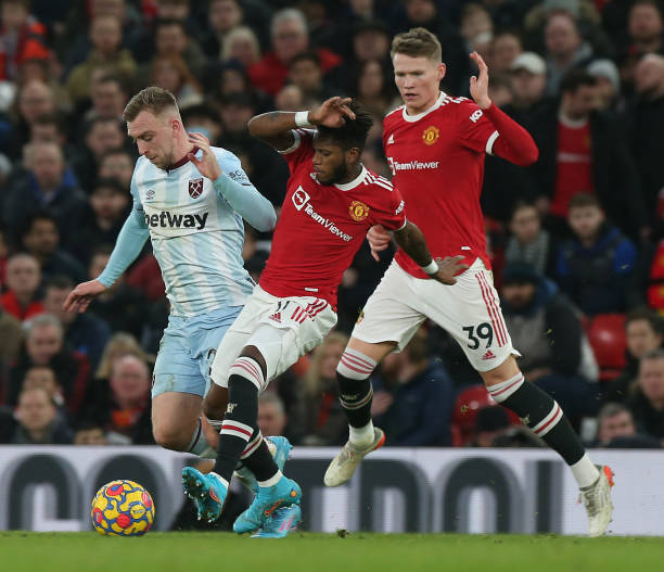 Fred of Manchester United in action with Jarrod Bowen of West Ham United during the Premier League match between Manchester United and West Ham...