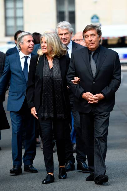 French TV host Jean-Pierre Foucault and his wife Evelyne Jarre arrive ...