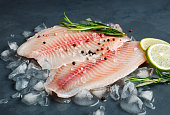 Fresh fish fillet of sea bass in ice.