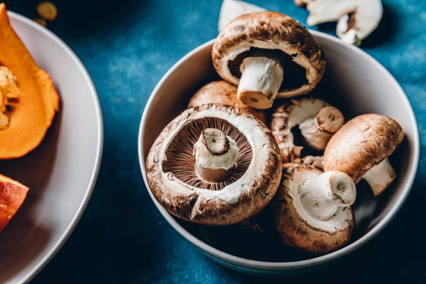 fresh mushrooms in a bowl - mushroom stock pictures, royalty-free photos & images