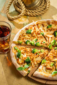 Fresh pizza with broccoli, chicken and cheese