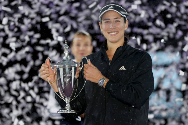 Garbiñe Muguruza of Spain celebrates with the Billie Jean King Trophy after defeating Anett Kontaveit of Estonia during the Women's Singles Final on...
