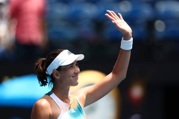 Garbine Muguruza of Spain thanks the crowd after winning her first round singles match against Clara Burel of France during day two of the 2022...