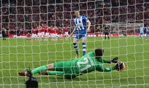 Gary Caldwell of Wigan has his penalty saved by Lukasz Fabianski during the FA Cup Semi-Final match between Wigan Athletic and Arsenal at Wembley...
