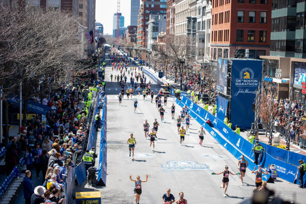 General view of runners approaching the finish line of the Boston Marathon on April 18, 2022 on Boylston Street in Boston, MA.