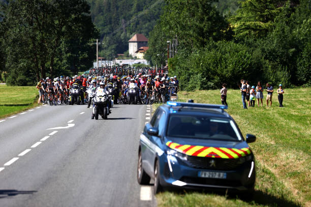 General view of the peloton stopped due to protesters in defending "Mont Blanc environment" blocking the route during the 109th Tour de France 2022,...