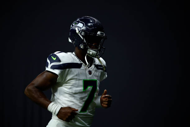 Geno Smith of the Seattle Seahawks walks off the field at half time against the New Orleans Saints at Caesars Superdome on October 09, 2022 in New...