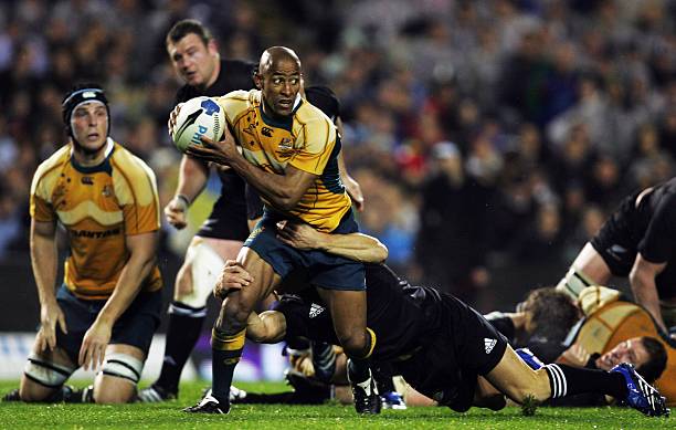 AUCKLAND, NEW ZEALAND - JULY 21: George Gregan of the Wallabies gets tackled during the 2007 Tri Nations series match between New Zealand and Australia at Eden Park on July 21, 2007 in Auckland, New Zealand. (Photo by Sandra Mu/Getty Images)