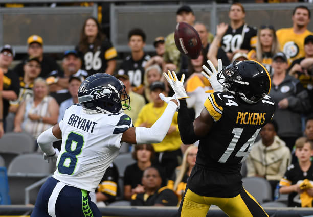 George Pickens of the Pittsburgh Steelers makes a catch for a 26-yard touchdown reception as Coby Bryant of the Seattle Seahawks defends in the first...
