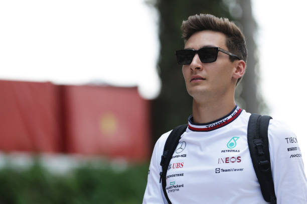 George Russell of Great Britain and Mercedes walks in the Paddock during previews ahead of the F1 Grand Prix of Miami at the Miami International...