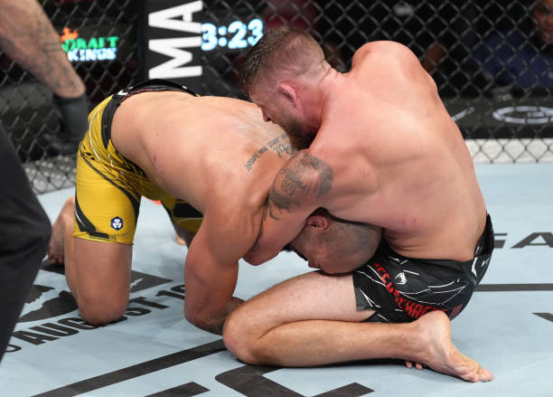 Gerald Meerschaert secures a guillotine choke submission against Bruno Silva of Brazil in a middleweight fight during the UFC Fight Night event at...