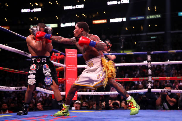 Gervonta Davis punches Isaac Cruz during their WBA World Lightweight Championship title bout at Staples Center on December 05, 2021 in Los Angeles,...