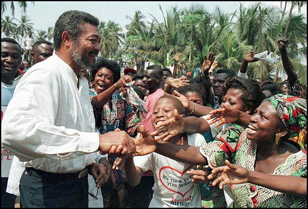 Ghanaian President Jerry Rawlings is cheered by supporters after he cast his vote in his country presidential and parliamentary elections in Accra 07...