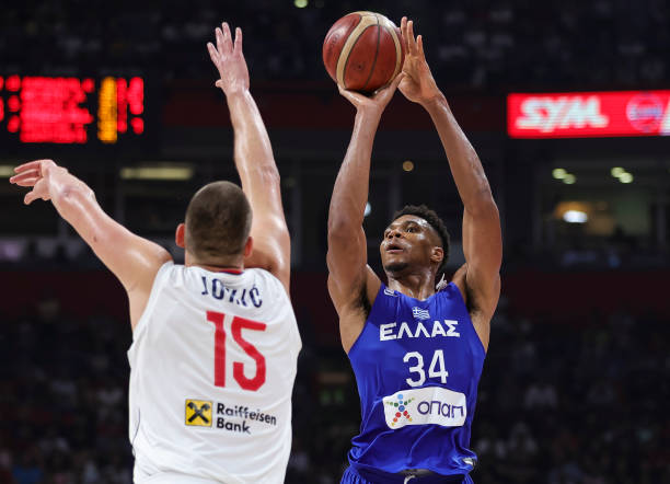 Giannis Antetokounmpo of Greece in action against Nikola Jokic of Serbia during the FIBA Basketball World Cup 2023 Qualifier game between Serbia and...