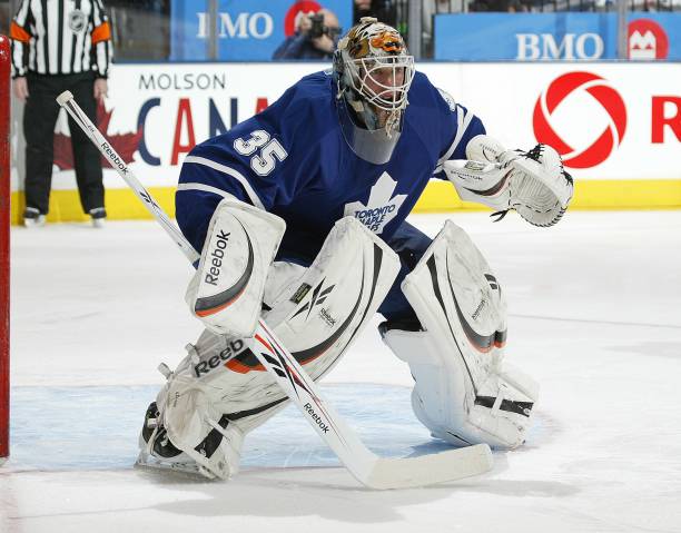 giguere-of-the-toronto-maple-leafs-keeps-an-eye-on-the-play-in-a-game-picture-id96547932