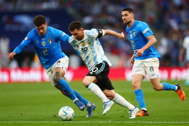 Giovanni Di Lorenzo of Italy challenges Lionel Messi of Argentina during the 2022 Finalissima match between Italy and Argentina at Wembley Stadium on...