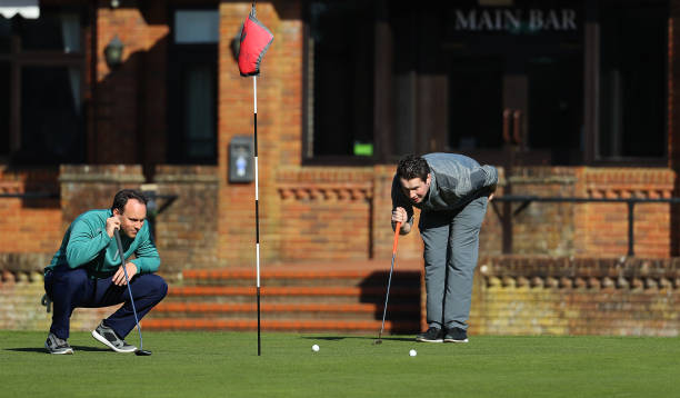Golfers play at Pine Ridge Golf Club on March 22, 2020 in Camberley, England. Coronavirus has spread to at least 188 countries, claiming over 13,000...