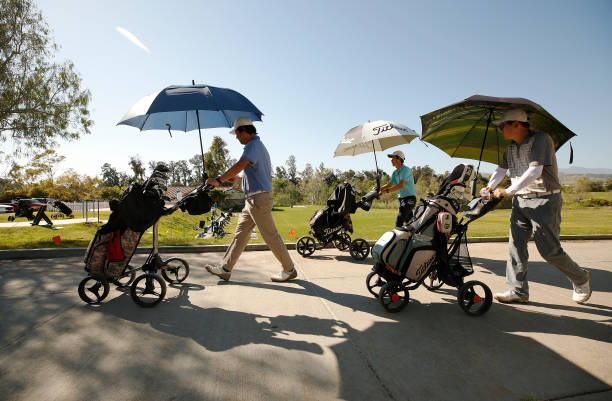 Golfers prepare to tee off at Sterling Hills Golf Club in Camarillo Wednesday which opened Monday with social distancing restrictions and other...