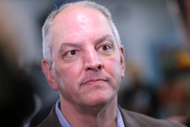 Gov. John Bel Edwards talks to media at the Case Closed Barbershop on November 15, 2019 in New Orleans, Louisiana. Louisiana residents head to the...