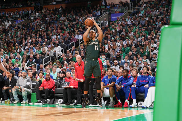 Grant Williams of the Boston Celtics shoots a three point basket during the game against the Philadelphia 76ers on October 18, 2022 at the TD Garden...