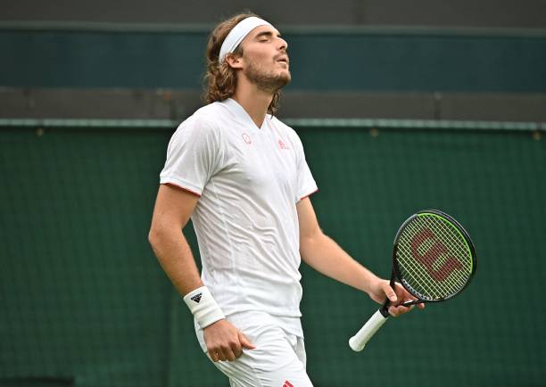 Greece's Stefanos Tsitsipas reacts to missing a point against US player Frances Tiafoe during their men's singles first round match on the first day...