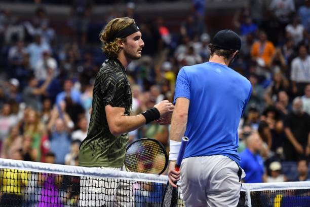 Greece's Stefanos Tsitsipas shakes hands with Britain's Andy Murray after winning their 2021 US Open Tennis tournament men's singles first round...
