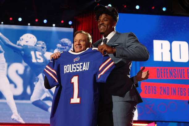 Gregory Rousseau stands with NFL Commissioner Roger Goodell onstage after being selected 30th by the Buffalo Bills during round one of the 2021 NFL...