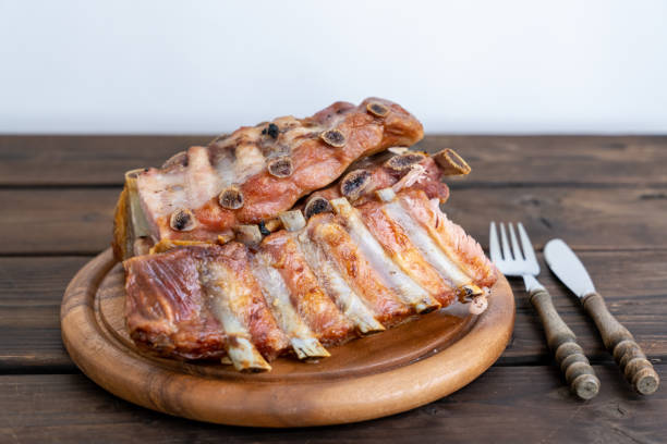 grilled pork ribs on wooden plate picture