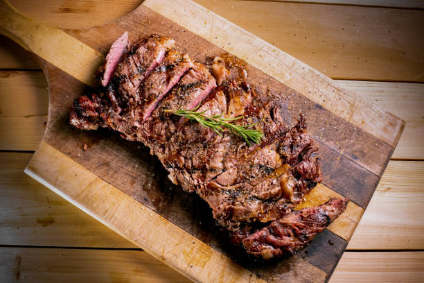 grilled ribeye steak on a cutting board picture