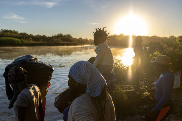 Haitian immigrant families cross the Rio Grande into Del Rio, Texas on September 23 from Ciudad Acuna, Mexico. Mexican immigration officials had...