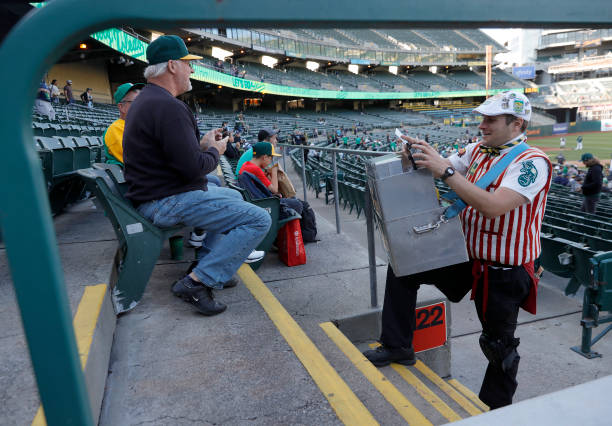 Hal Hal the Hot Dog Guy Gordon sells hot dogs during the Oakland Athletics game against the Houston Astros at the Coliseum in Oakland, Calif., on...