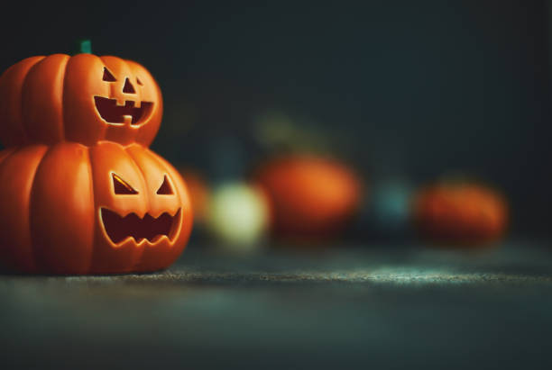 halloween background with jack o`lantern and pumpkins - halloween stock pictures, royalty-free photos & images