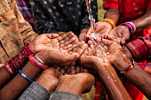 Hands of poor - African children asking for drinking water