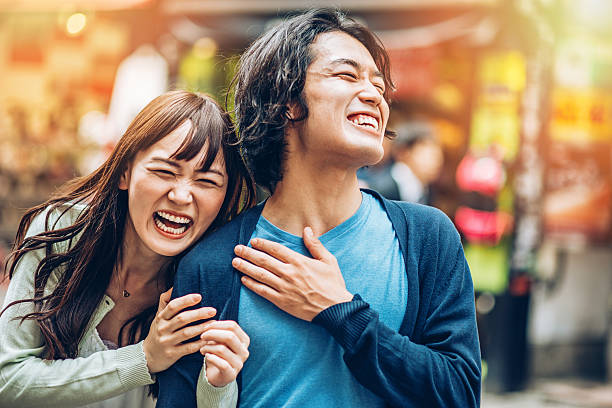 happy japanese couple - asian man and woman friend stock pictures, royalty-free photos & images