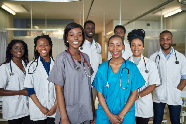 happy medical students standing in hospital ward picture