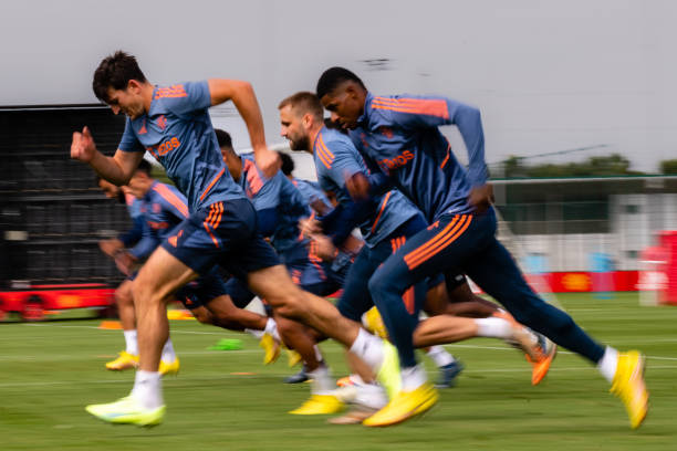 Harry Maguire, Marcus Rashford of Manchester United in action during a first team training session at Carrington Training Ground on August 17, 2022...