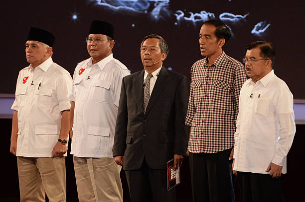 Hatta Rajasa vice presidential candidate from left Prabowo Subianto presidential candidate Sudharto P Hadi debate moderator Joko Widodo governor of...