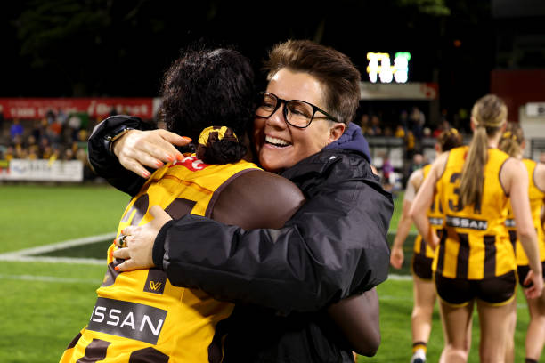 Hawks coach Bec Goddard is pictured hugging Akec Makur Chuot after their win during the round seven AFLW match between the Hawthorn Hawks and the...