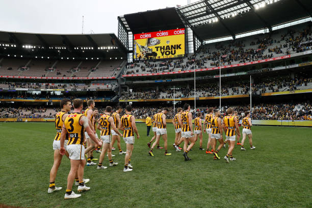 Hawthorn leave the field after a loss during the 2022 AFL Round 22 match between the Richmond Tigers and the Hawthorn Hawks at the Melbourne Cricket...
