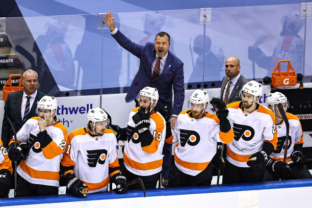 Head coach Alain Vigneault of the Philadelphia Flyers reacts against the New York Islanders during the first overtime period in Game Six of the...