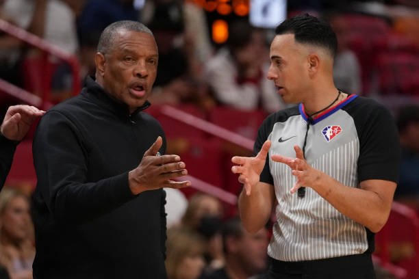 Head coach Alvin Gentry of the Sacramento Kings talks with referee Ray Acosta during the first half against the Miami Heat at FTX Arena on March 28,...