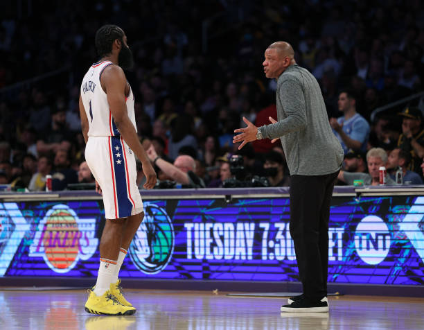 Head coach Doc Rivers of the Philadelphia 76ers speaks with James Harden of the Philadelphia 76ers during a 126-121 win over the Los Angeles Lakers...