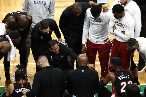 Head Coach Erik Spoelstra of the Miami Heat talks with the team against the Boston Celtics during a break in the first quarter in Game Four of the...