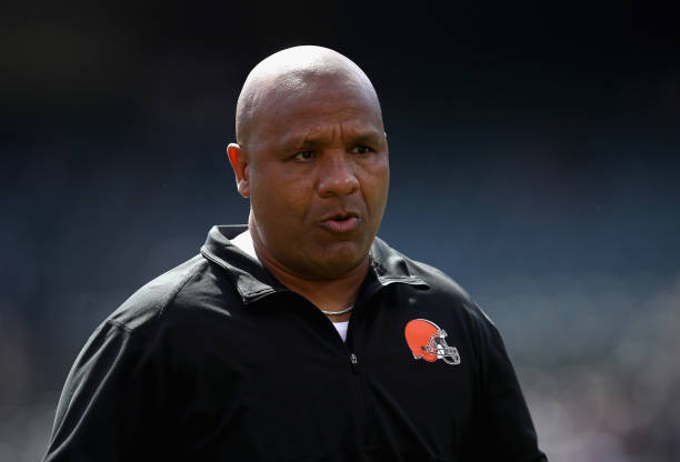 Head coach Hue Jackson of the Cleveland Browns stands on the field before their game against the Oakland Raiders at Oakland-Alameda County Coliseum...