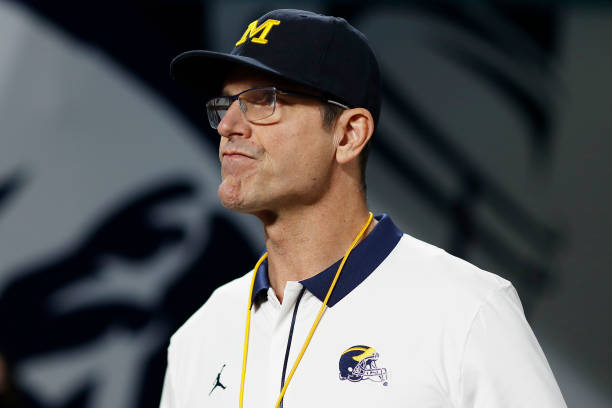Head Coach Jim Harbaugh of the Michigan Wolverines looks on before the game against the Georgia Bulldogs in the Capital One Orange Bowl for the...