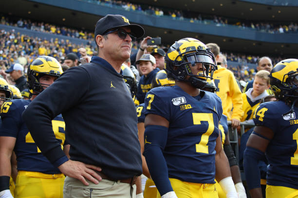 Head coach Jim Harbaugh waits to take the field to play the Iowa Hawkeyes at Michigan Stadium on October 05, 2019 in Ann Arbor, Michigan. Michigan...