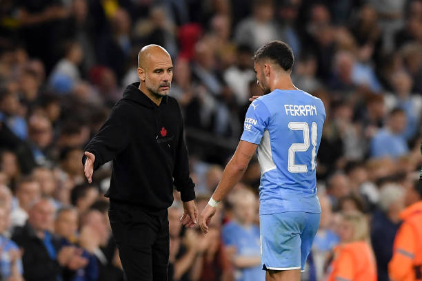 Head coach Pep Guardiola of Manchester City and Ferran Torres of Manchester City gestures during the UEFA Champions League group A match between...