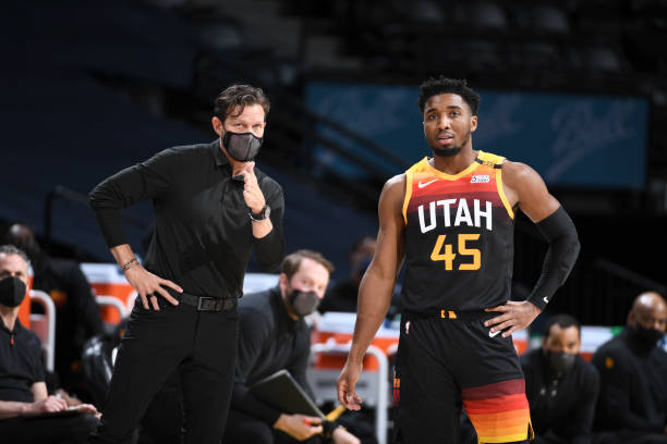 Head Coach Quin Snyder of the Utah Jazz talks to Donovan Mitchell of the Utah Jazz during the game against the Denver Nuggets on January 31, 2021 at...