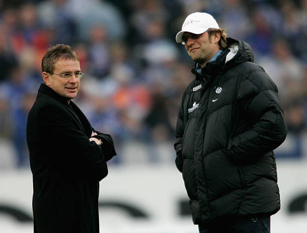 Head coach Ralf Rangnick of Schalke and head coach Juergen Klopp of Mainz smile before the Bundesliga match between Schalke 04 and FSV Mainz 05 at...